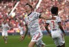 Bayern's Robert Lewandowski celebrates after scoring his side's second goal during the German Bundesliga soccer match between Bayer Leverkusen and Bayern Munich in Leverkusen, Germany, Sunday, Oct. 17, 2021. (AP Photo/Martin Meissner)