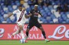 Napoli's Victor Osimhen, right, and Torino's Bremer vie for the ball during the Serie A soccer match between Napoli and Torino, at the Diego Armando Maradona stadium in Naples, Italy, Sunday, Oct. 17, 2021. (Alessandro Garofalo/LaPresse via AP)