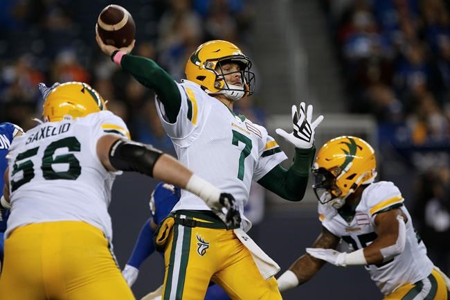 Edmonton Elks quarterback Trevor Harris (7) throws against the Winnipeg Blue Bombers during the first half of CFL action in Winnipeg Friday, Oct. 8, 2021. The Edmonton Elks have traded quarterback Trevor Harris to the Montreal Alouettes for defensive end Antonio Simmons. THE CANADIAN PRESS/John Woods