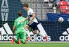 Vancouver Whitecaps' Ryan Gauld, front, celebrates his goal against Sporting Kansas City goalkeeper Tim Melia during first half MLS soccer action in Vancouver, B.C., Sunday, Oct. 17, 2021. THE CANADIAN PRESS/Darryl Dyck
