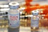 FILE - This Thursday, Feb. 25, 2021 file photo shows vials for the Moderna and Pfizer COVID-19 vaccines at a temporary clinic in Exeter, N.H. In September, 2021, the Food and Drug Administration approved extra doses of Pfizer’s original COVID-19 vaccine after studies showed it still works well enough against the delta variant. And the FDA is weighing evidence for boosters of the original Moderna and Johnson & Johnson vaccines. (AP Photo/Charles Krupa)