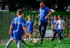 Football legend Didier Drogba plays with childs after being appointed as World Health Organization's Goodwill Ambassador for Sport and Health at the WHO headquarters in Geneva on Monday, October 18, 2021. A native of Ivory Coast, Drogba will help the WHO to promote its guidance on the benefits of physical activity and other healthy lifestyles, and communicate the value of sport, especially to young people. (Fabrice Coffrini/Keystone via AP)