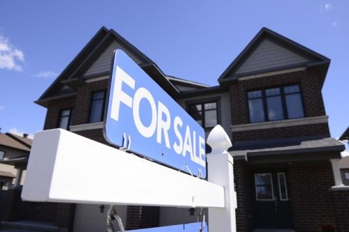 A home for sale is displayed in a new housing development in Ottawa on Tuesday, July 14, 2020. THE CANADIAN PRESS/Sean Kilpatrick
