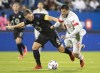 CF Montreal’s Samuel Piette, left, challenges Toronto FC’s Alejandro Pozuelo during second half MLS soccer action in Montreal, Friday, August 27, 2021. THE CANADIAN PRESS/Graham Hughes