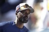 Milwaukee Brewers hitting coach Darnell Coles is seen in the dugout during a spring training baseball game against the Cleveland Indians, Monday, Feb. 26, 2018, in Maryvale, Ariz. The Washington Nationals are hiring Darnell Coles as hitting coach. Coles is a former major league player who was most recently the hitting coach for the Arizona Diamondbacks before being fired in June. He replaces Kevin Long, who left Washington to become the hitting coach for the Philadelphia Phillies. (AP Photo/Carlos Osorio)