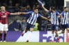Porto's Luis Diaz, center, celebrates after scoring the opening goal during the Champions League group B soccer match between FC Porto and AC Milan at the Dragao stadium in Porto, Portugal, Tuesday, Oct. 19, 2021. (AP Photo/Luis Vieira)