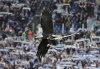 An eagle is seen as part of entertainment before the Serie A soccer match between Lazio and Inter Milan at Rome's Olympic stadium, Saturday, Oct. 16, 2021. (AP Photo/Alessandra Tarantino)