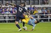 FC Cincinnati defender Geoff Cameron (12) tackles Philadelphia Union midfielder Quinn Sullivan during the second half of an MLS soccer match Saturday, Oct. 9, 2021, in Cincinnati. (AP Photo/Jeff Dean)