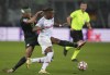 Wolfsburg's Aster Vranckx, left, fights for the ball with Salzburg's Chukwubuike Adamu during the Champions League group G soccer match between Salzburg and VfL Wolfsburg, at the Salzburg stadium, in Salzburg, Austria, Wednesday, Oct. 20, 2021. (AP Photo/Matthias Schrader)