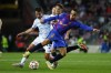 Barcelona's Sergino Dest, right, challenges for the ball with Dynamo Kyiv's Carlos de Pena during a Champions League group E soccer match between F.C. Barcelona and Dinamo Kyiv at Camp Nou stadium in Barcelona, Spain, Wednesday, Oct. 20, 2021. (AP Photo/Joan Monfort)