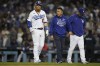 Los Angeles Dodgers' Justin Turner is escorted off the field after grounding out during gate seventh inning against the Atlanta Braves in Game 4 of baseball's National League Championship Series Wednesday, Oct. 20, 2021, in Los Angeles. (AP Photo/Jae Hong)