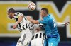 Juventus' Leonardo Bonucci, left, challenges for the ball with Zenit's Artem Dzyuba, right, during the Champions League group H soccer match between Zenit St. Petersburg and Juventus at the Gazprom Arena in St.Petersburg, Russia, Wednesday, Oct. 20, 2021. (AP Photo/Dmitry Lovetsky)