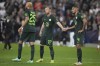 Wolfsburg's Maximilian Arnold, center, cheers Wolfsburg's Maxence Lacroix end of the Champions League group G soccer match between Salzburg and VfL Wolfsburg, at the Salzburg stadium, in Salzburg, Austria, Wednesday, Oct. 20, 2021. Salzburg won 3-1. (AP Photo/Matthias Schrader)