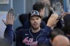 Atlanta Braves' Freddie Freeman is congratulated after hitting a two-run home run during the first inning against the Los Angeles Dodgers in Game 5 of baseball's National League Championship Series Thursday, Oct. 21, 2021, in Los Angeles. (AP Photo/Ashley Landis)