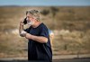 Alec Baldwin speaks on the phone in the parking lot outside the Santa Fe County Sheriff's Office in Santa Fe, N.M., after he was questioned about a shooting on the set of the film 