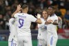 Left to right: Real Madrid's Lucas Vazquez, Karim Benzema, Luka Modric and David Alaba celebrate after scoring their side's second goal during the Champions League group D soccer match between Shakhtar Donetsk and Real Madrid at the Olympiyskiy stadium in Kyiv, Ukraine, Tuesday, Oct. 19, 2021. (AP Photo/Efrem Lukatsky)