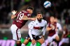 Torino's Antonio Sanabria scores his side's opening goal during the Serie A soccer match between Torino and Genoa, at the Turin Olympic stadium, Italy, Friday, Oct. 22, 2021. (Fabio Ferrari/LaPresse via AP)