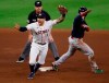Houston Astros shortstop Carlos Correa celebrates after catching Boston Red Sox's Alex Verdugo trying to steal second base during the seventh inning of Game 6 of the baseball AL Championship Series, Friday, Oct. 22, 2021, in Houston. (Kevin M. Cox/The Galveston County Daily News via AP)