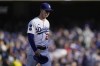 Los Angeles Dodgers pitcher Walker Buehler walks off the mound after being relieved in the fourth inning against the Atlanta Braves in Game 3 of baseball's National League Championship Series Tuesday, Oct. 19, 2021, in Los Angeles. (AP Photo/Jae Hong)