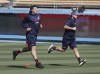 Braves third baseman Austin Riley, left, and pitcher A.J. Minter run sprints as they prepare to play the Dodgers in game 5 of the NLCS on Thursday, Oct. 21, 2021, in Los Angeles. 