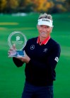 Bernhard Langer holds his trophy after winning the Dominion Energy Charity Classic golf tournament at Country Club of Virginia on Sunday, Oct. 24, 2021, in Richmond, Va. (Daniel Sangjib Min/Richmond Times-Dispatch via AP