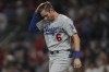 Los Angeles Dodgers' Trea Turner reacts after striking out in the first inning in Game 6 of baseball's National League Championship Series against the Atlanta Braves Saturday, Oct. 23, 2021, in Atlanta. (AP Photo/Brynn Anderson)