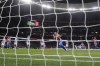 Atletico Madrid's Luis Suarez, center, celebrates after scoring a penalty shot, his side's second goal, during the La Liga soccer match between Atletico Madrid and Real Sociedad at the Estadio Wanda Metropolitano in Madrid, Sunday, Oct. 24, 2021. (AP Photo/Manu Fernandez)