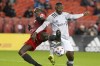 Toronto FC's Chris Mavinga (left) battles for the ball with CF Montreal's Sunusi Ibrahim during first half MLS action in Toronto on Saturday, October 23, 2021.&nbsp;Toronto FC plays its penultimate home game of a dismal MLS season when it hosts Philadelphia on Wednesday.&nbsp;THE CANADIAN PRESS/Chris Young