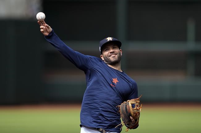 Houston Astros second baseman Jose Altuve warms up during batting practice Monday, Oct. 25, 2021, in Houston, in preparation for Game 1 of baseball's World Series tomorrow between the Houston Astros and the Boston Red Sox. (AP Photo/David J. Phillip)