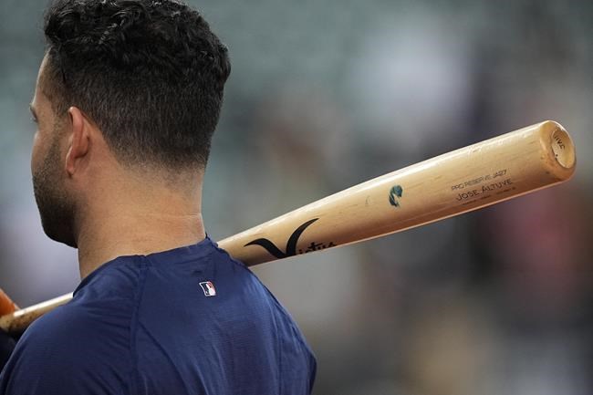 Houston Astros' Jose Altuve watches during batting practice before Game 1 in baseball's World Series against the Atlanta Braves Tuesday, Oct. 26, 2021, in Houston. (AP Photo/David J. Phillip)