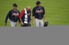 Atlanta Braves starting pitcher Charlie Morton, right, is helped off the field during the third inning of Game 1 in baseball's World Series between the Houston Astros and the Atlanta Braves Tuesday, Oct. 26, 2021, in Houston. (AP Photo/Eric Gay)
