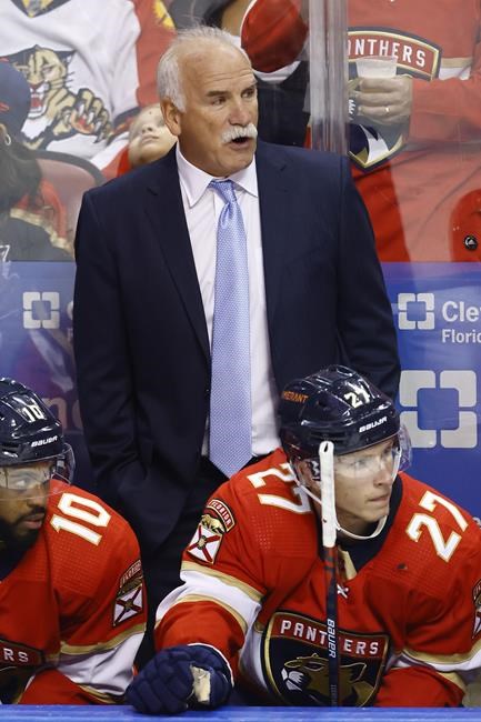 Florida Panthers head coach Joel Quenneville watches play during the third period of an NHL hockey game against the Arizona Coyotes, Monday, Oct. 25, 2021, in Sunrise, Fla. (AP Photo/Michael Reaves)