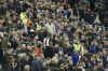 Fans stand around a person with a possible medical problem in the crowd during an English Premier League soccer match between Newcastle and Tottenham Hotspur at St. James' Park in Newcastle, England, Sunday Oct. 17, 2021. (AP Photo/Jon Super)