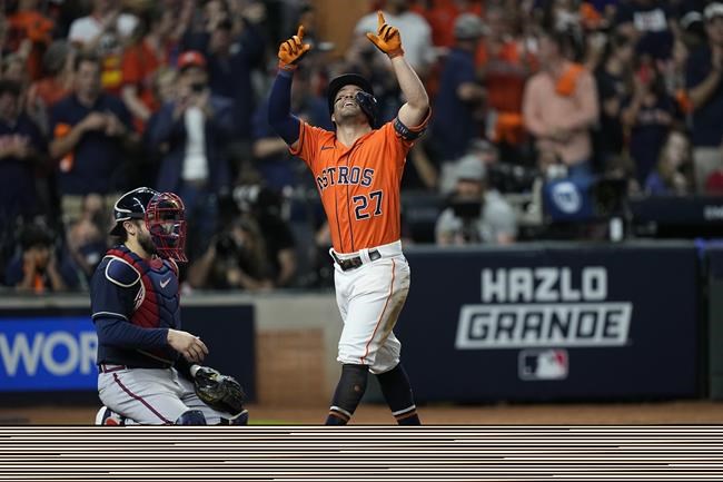Houston Astros' Jose Altuve celebrates after a home run during the seventh inning in Game 2 of baseball's World Series between the Houston Astros and the Atlanta Braves Wednesday, Oct. 27, 2021, in Houston. (AP Photo/David J. Phillip)