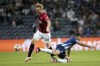 AC Milan's Simon Kjaer fights for the ball with Porto's Mehdi Taremi, right, during the Champions League group B soccer match between FC Porto and AC Milan at the Dragao stadium in Porto, Portugal, Tuesday, Oct. 19, 2021. (AP Photo/Luis Vieira)