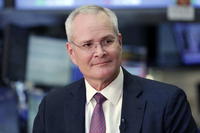FILE - In this March 1, 2017 file photo, Exxon Mobil Chairman & CEO Darren Woods is interviewed on the floor of the New York Stock Exchange. Top executives at ExxonMobil and other oil giants are set to testify at a landmark House hearing Thursday as congressional Democrats investigate what they describe as a decades-long, industry-wide campaign to spread disinformation about the role of fossil fuels in causing global warming. (AP Photo/Richard Drew)