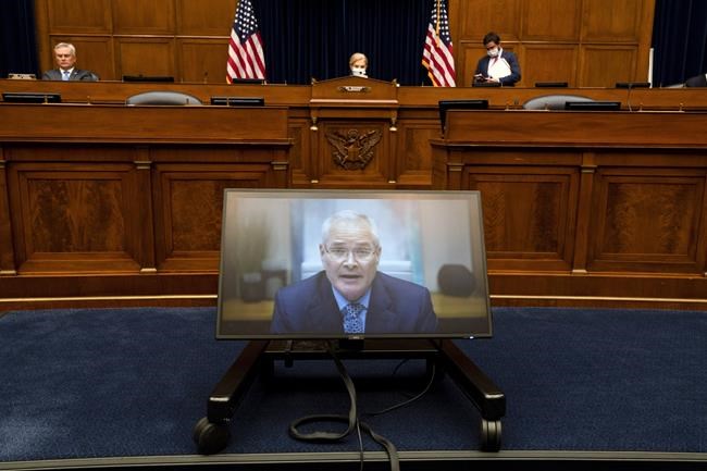 Darren Woods, CEO of ExxonMobil testifies via video conference during a House Committee on Oversight and Reform hearing on the role of fossil fuel companies in climate change, Thursday, Oct. 28, 2021, on Capitol Hill in Washington. (AP Photo/Jacquelyn Martin)
