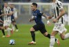 Inter Milan's Lautaro Martinez controls the ball during a Serie A soccer match between Inter Milan and Juventus at the San Siro stadium in Milan, Italy, Sunday, Oct. 24, 2021. (AP Photo/Luca Bruno)