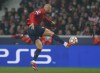 Lille's Burak Yilmaz kicks the ball ahead of Lille during the group G Champions League soccer match between Lille and Sevilla at the Stade Pierre Mauroy - Villeneuve d'Ascq stadium in Lille, France, Wednesday, Oct. 20, 2021. (AP Photo/Michel Spingler)