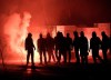 File - Union Berlin supporters set off flares to welcome their team outside the stadium before the German Bundesliga game against Bayern Munich in Berlin, Germany, Dec. 12, 2020. UEFA has sanctioned German soccer club Union Berlin with a partial stadium closure for the antisemitic behavior of some of its fans toward supporters of Israeli team Maccabi Haifa. UEFA ordered Union to close sectors 13 and 14 for its next game in the competition and display a banner with the wording “#NoToRacism” and the UEFA logo there.(AP Photo/Ciaran Fahey, File)