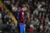 Barcelona's Gerard Pique gestures at the end of the Spanish La Liga soccer match between Rayo Vallecano and FC Barcelona at the Vallecas stadium in Madrid, Spain, Wednesday, Oct. 27, 2021. Rayo Vallecano won 1-0. (AP Photo/Manu Fernandez)