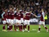 West Ham players celebrate on the pitch during the penalty shootout at the end of the English League Cup fourth round soccer match between West Ham United and Manchester City, at the London Stadium, in London, Wednesday, Oct. 27, 2021. (AP Photo/Ian Walton)