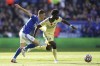 Leicester City's Luke Thomas, left and Arsenal's Bukayo Saka battle for the ball, during the English Premier League soccer match between Leicester City and Arsenal, at the King Power Stadium, in Leicester, England, Saturday, Oct. 30, 2021. (Zac Goodwin/PA via AP)