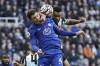 Chelsea's Andreas Christensen, left, and Newcastle United's Jamaal Lascelles battle for the ball during the English Premier League soccer match between Newcastle United and Chelsea at St. James' Park, Newcastle, England, Saturday Oct. 30, 2021. (Owen Humphreys/PA via AP)