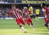 Southampton's Che Adams celebrates scoring during the English Premier League soccer match between Watford and Southampton at Vicarage Road, Watford, England, Saturday Oct. 30, 2021. (Tess Derry/PA via AP)
