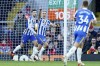Brighton's Leandro Trossard, center, celebrates after scoring his side's second goal during the English Premier League soccer match between Liverpool and Brighton and Hove Albion at Anfield Stadium, Liverpool, England, Saturday, Oct. 30, 2021. (AP Photo/Jon Super)