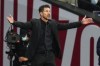 Atletico Madrid's head coach Diego Simeone reacts during the La Liga soccer match between Atletico Madrid and Real Sociedad at the Estadio Wanda Metropolitano in Madrid, Sunday, Oct. 24, 2021. (AP Photo/Manu Fernandez)