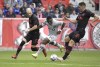 CF Montréal forward Sunusi Ibrahim (22) attempts to go between New York Red Bulls defenders Andrew Gutman, left, and Sean Nealis, right, during the first half of an MLS soccer match, Saturday, Oct. 30, 2021, in Harrison, N.J. (AP Photo/Bill Kostroun)