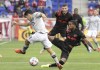 CF Montréal midfielder Joaquin Torres, left, attempts to take a shot as New York Red Bulls defender Kyle Duncan defends during the first half of an MLS soccer match, Saturday, Oct. 30, 2021, in Harrison, N.J. (AP Photo/Bill Kostroun)