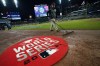 Members of the grounds crew prepare the field for Game 4 of baseball's World Series between the Houston Astros and the Atlanta Braves Saturday, Oct. 30, 2021, in Atlanta.(AP Photo/David J. Phillip)